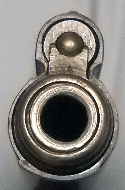 detail, Frommer Stop muzzle, showing barrel jacket and top-mounted recoil spring